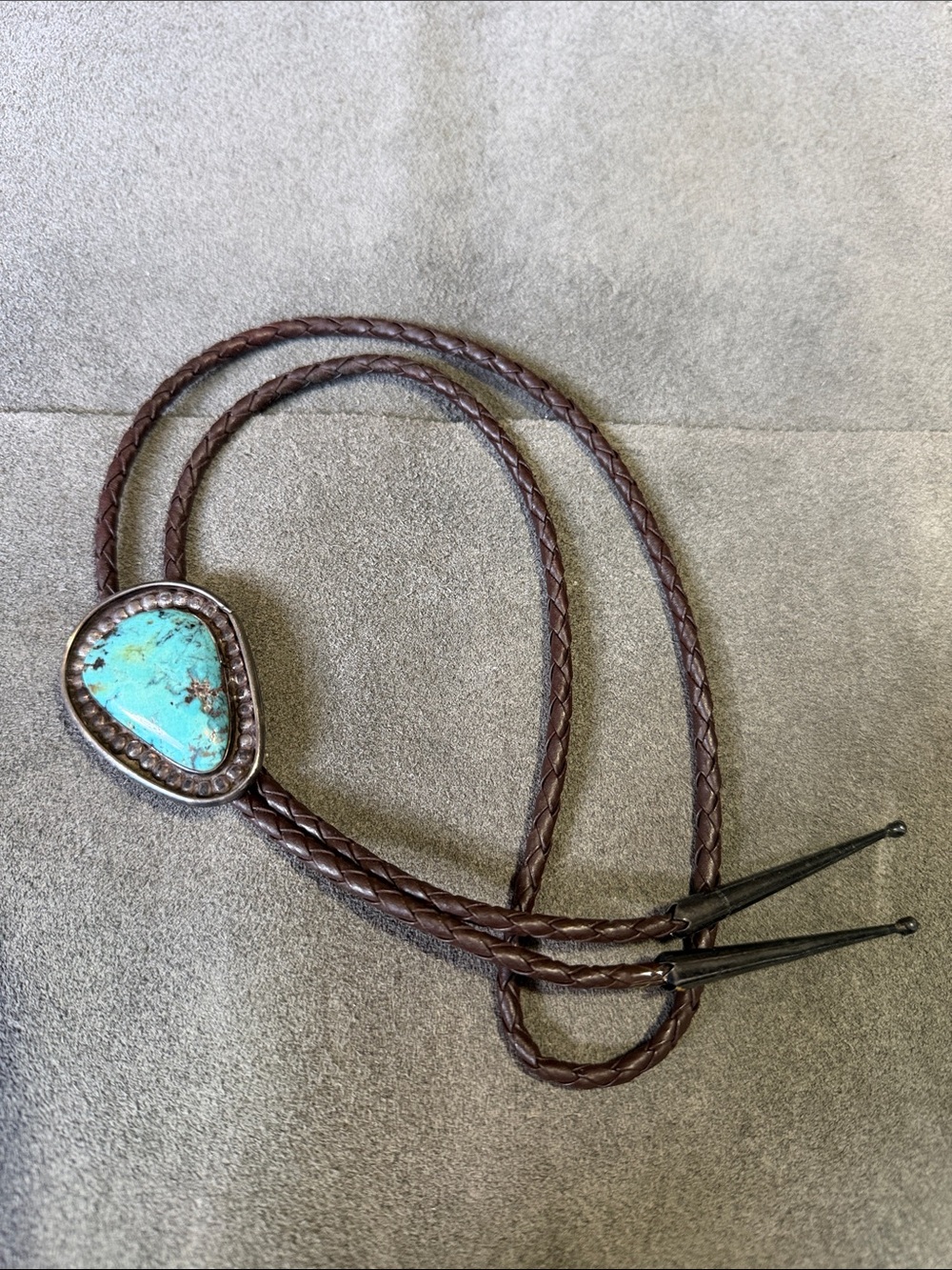 Silver and Turquoise Bolo Tie on Brown Leather